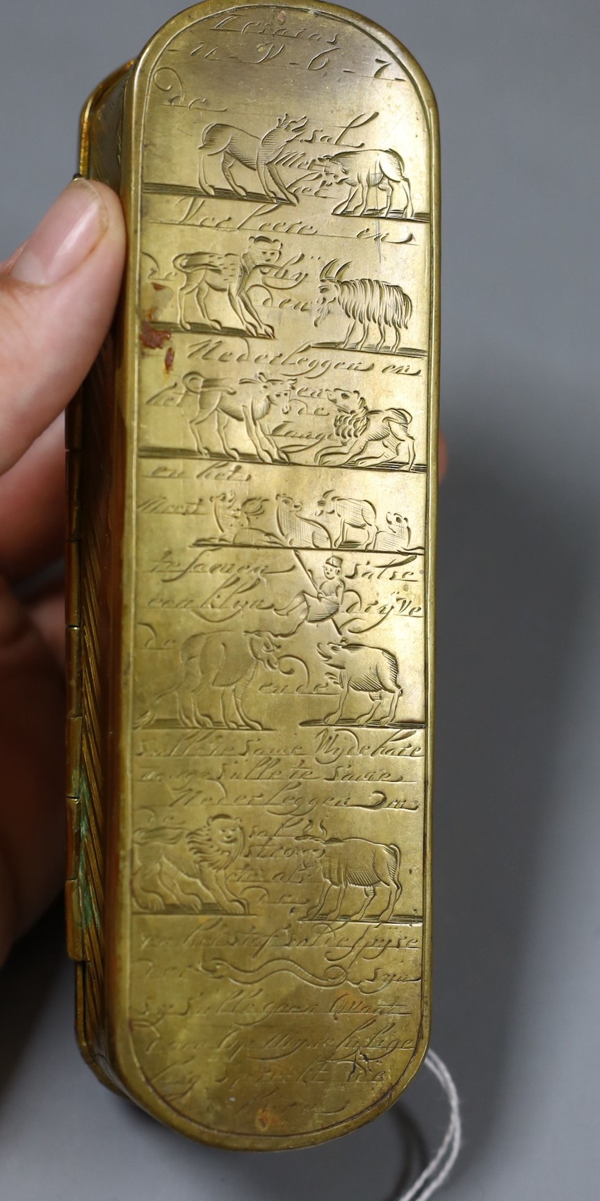 A 17th/18th century finely engraved Dutch brass tobacco box - 15.5cm long